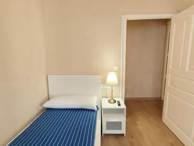 Cama o camas de una habitación en La Modernidad del Casco by Alogest