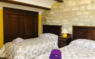 Cama o camas de una habitación en Casa Rural LES PLETES