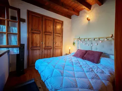 Cama o camas de una habitación en Calideza máxima- Chimenea, balcón y jardín - Cosmos 2