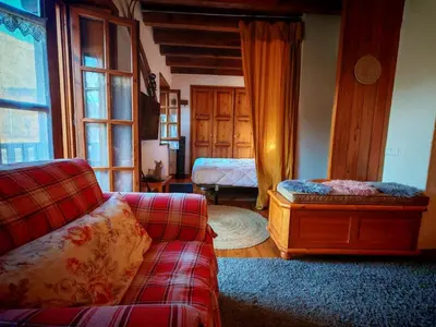 Cama o camas de una habitación en Calideza máxima- Chimenea, balcón y jardín - Cosmos 2