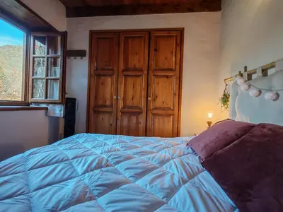 Cama o camas de una habitación en Calideza máxima- Chimenea, balcón y jardín - Cosmos 2