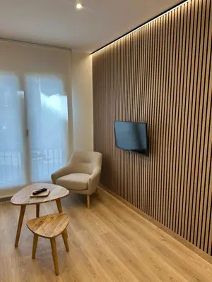 Una televisión o centro de entretenimiento en El tossalet Hotel - Apartament