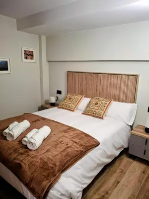 Cama o camas de una habitación en Apartamentos Casa Domec