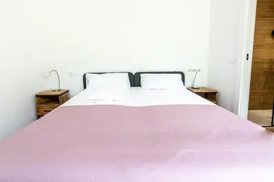 Cama o camas de una habitación en Las casitas de mache - LAGOSSA
