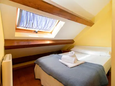Cama o camas de una habitación en Apartamentos Canfranc 3000