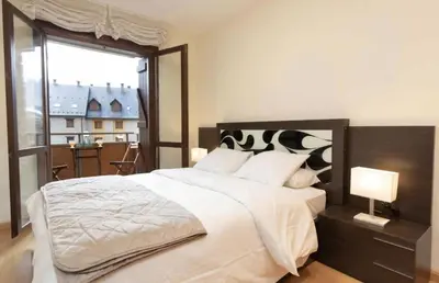 Cama o camas de una habitación en Cota de la marmota by CARDI Suites