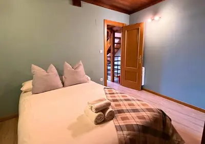 Cama o camas de una habitación en Ático Miraestrela: Dúplex con Vistas a Sallent