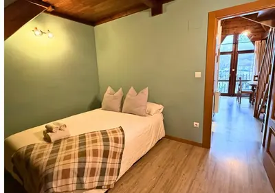 Cama o camas de una habitación en Ático Miraestrela: Dúplex con Vistas a Sallent
