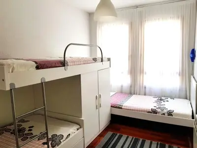 Cama o camas de una habitación en Vivienda Turística Pirineos XXI
