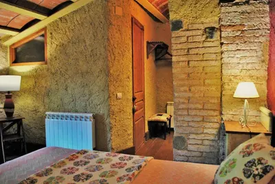 Cama o camas de una habitación en Masia El Canalot - Molí Del Pont