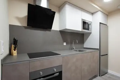Una cocina o zona de cocina en Apartamentos Bombón Tudela