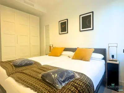 Cama o camas de una habitación en Dos Torres Las Canteras