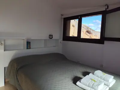 Cama o camas de una habitación en Pasarelas Ático junto a la Colegiata