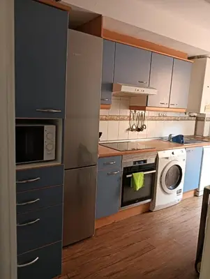Una cocina o zona de cocina en Apartamento en el centro encima de piscina Palafox