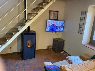 Una televisión o centro de entretenimiento en Casa Riveret