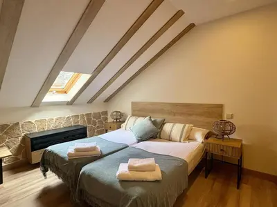 Cama o camas de una habitación en Atico de lujo en el Pirineo