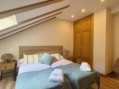 Cama o camas de una habitación en Atico de lujo en el Pirineo
