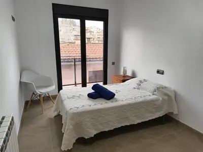 Cama o camas de una habitación en Apartamentos La Aubaga