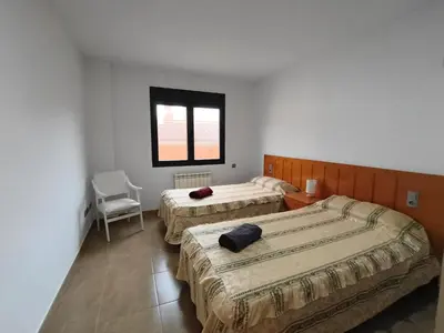 Cama o camas de una habitación en Apartamentos La Aubaga