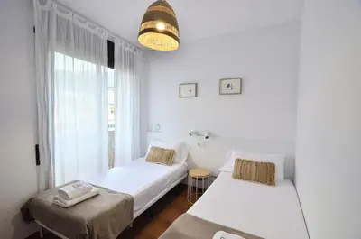 Cama o camas de una habitación en Apartaments la Rambla - L'Arrel - 4 persones
