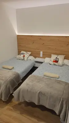 Cama o camas de una habitación en Apartamentos Leyre Candanchú