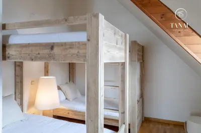 Cama o camas de una habitación en Tanau Rentals - TKS