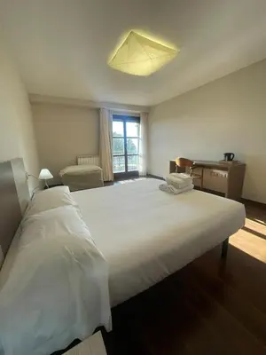 Cama o camas de una habitación en Hotel Santuario de Sancho Abarca