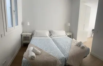 Cama o camas de una habitación en Apartaments Plaza Príncipe Viana