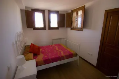 Cama o camas de una habitación en Apartamentos Turisticos Rio Gallego