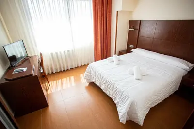 Cama o camas de una habitación en Hotel Villa De Cárcar