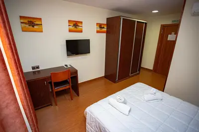 Cama o camas de una habitación en Hotel Villa De Cárcar