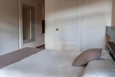 Cama o camas de una habitación en Hotel Baztan