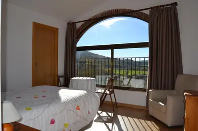 Cama o camas de una habitación en Masia Molí de Tartareu