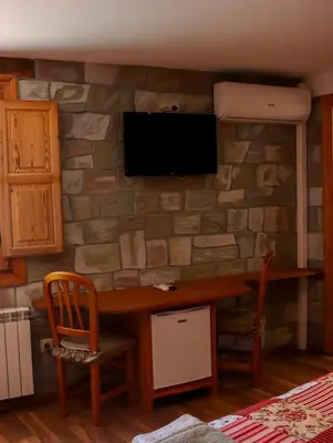 Una televisión o centro de entretenimiento en Las Bodegas De Claveria