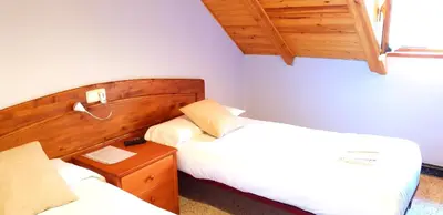 Cama o camas de una habitación en Casa Rural Cuny