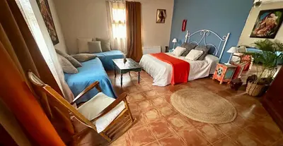 Cama o camas de una habitación en Apartamentos la Jayma del Arte
