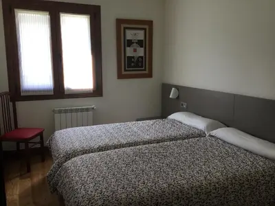 Cama o camas de una habitación en Apartamentos Irati