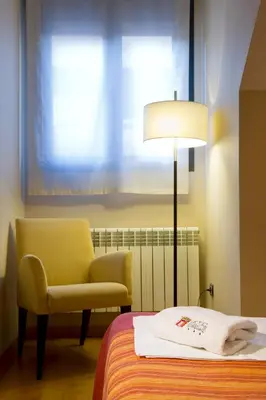 Cama o camas de una habitación en SNÖ Hotel Ciudad de Sabiñánigo