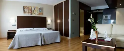 Cama o camas de una habitación en SNÖ Hotel Ciudad de Sabiñánigo