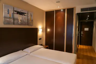 Cama o camas de una habitación en SNÖ Hotel Ciudad de Sabiñánigo