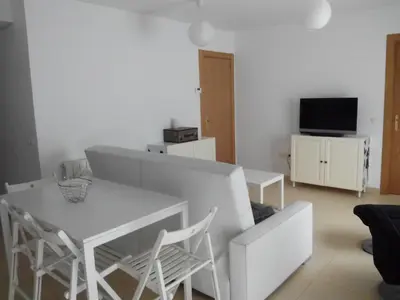 Una televisión o centro de entretenimiento en Apartamento La Rueda