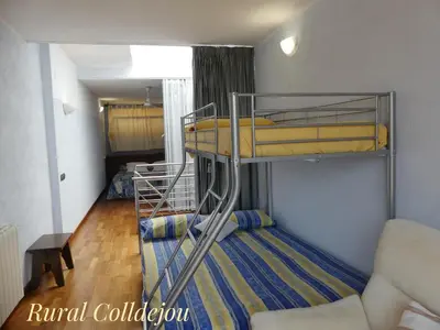 Cama o camas de una habitación en Rural Colldejou Cal Caterí