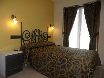 Cama o camas de una habitación en Hotel Meson de L’Ainsa