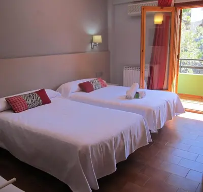 Cama o camas de una habitación en Hotel Meson de L’Ainsa