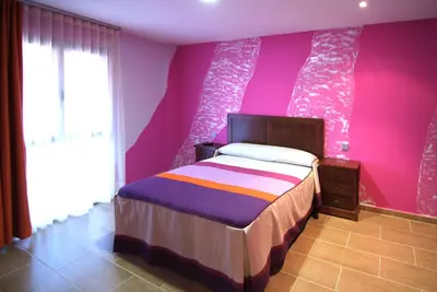 Cama o camas de una habitación en Apartahotel La Corrala