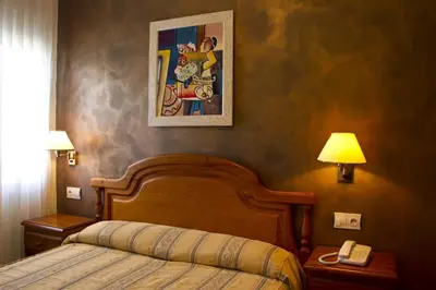 Cama o camas de una habitación en Hotel Clemente