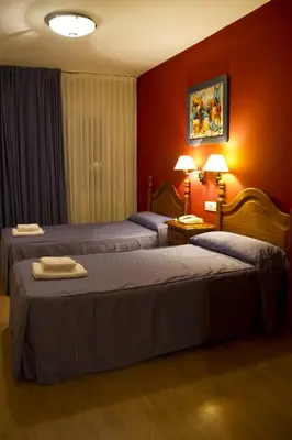 Cama o camas de una habitación en Hotel Clemente