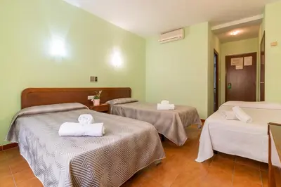 Cama o camas de una habitación en Hotel Sierra de Arcos