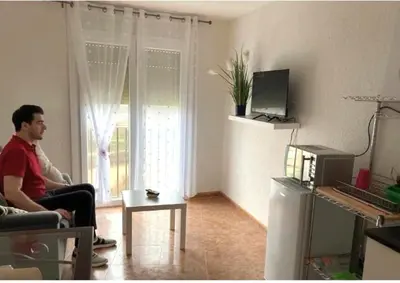Una televisión o centro de entretenimiento en Montrebei Casa González Apartamentos