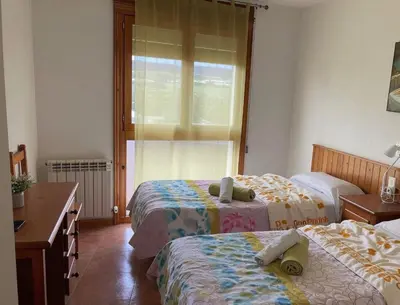 Cama o camas de una habitación en Montrebei Casa González Apartamentos